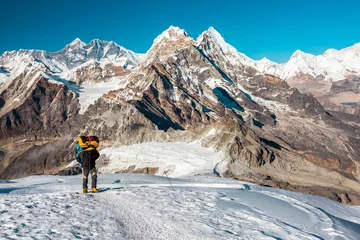 Papier Peint photo Alpinisme Mountain Climber ascending high Altitude Peak walking on Snow terrain