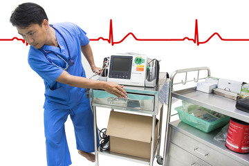 doctor moving defibrillator and AED EKG or ECG monitor