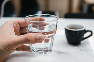 glass of water in hand