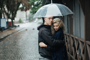 Couple on the street with umbrella