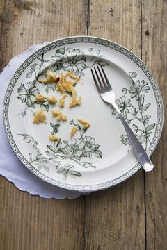 An empty plate with leftover Sp&auml;tzle (soft egg noodles from Swabia)