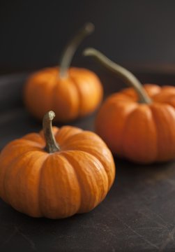 Three Orange Mini Pumpkins