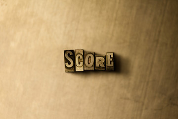SCORE - close-up of grungy vintage typeset word on metal backdrop. Royalty free stock illustration.  Can be used for online banner ads and direct mail.