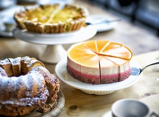 A cake buffet wuth three different cakes