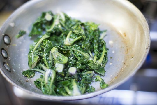 Leaf vegetables in a frying pan