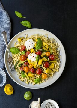 Spaghetti with anchovy paste, saut&eacute;ed vegetables, burrata and basil
