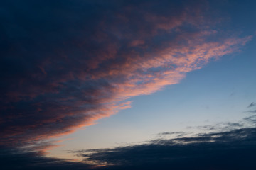 Dramatic sunset sky with clouds.