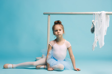 The little balerina dancer on blue background © master1305