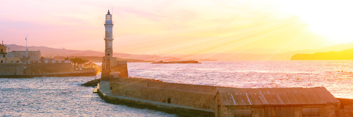 Lighthouse in old harbour of Chania at dawn, Crete, Greece - obrazy, fototapety, plakaty