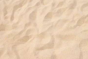 Fotobehang Fijn strandzand in de zomerzon © BUDDEE