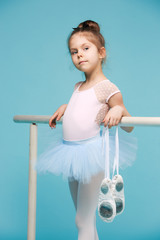 The little balerina dancer on blue background © master1305