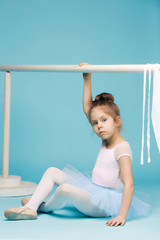 The little balerina dancer on blue background © master1305