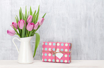 Pink tulip flowers bouquet and gift box