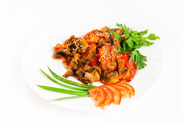 Plate of vegetable ragout with mushrooms isolated at white background.
