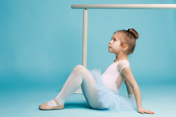 The little balerina dancer on blue background © master1305