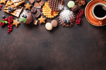 Coffee, sweets and waffles with berries