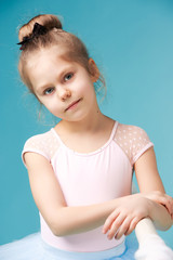 The little balerina dancer on blue background © master1305
