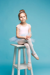 The little balerina dancer on blue background © master1305