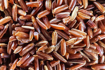 Macro texture of wild brown rice as food background.