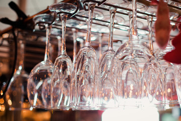 Empty wine glasses at a bar