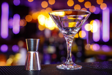 Empty martini glass in a nightclub