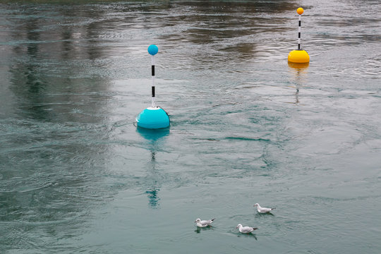 markings on the water. River in autumn image with buoys