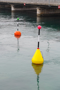 markings on the water. River in autumn image with buoys
