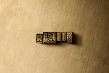 REALLY - close-up of grungy vintage typeset word on metal backdrop. Royalty free stock illustration.  Can be used for online banner ads and direct mail.