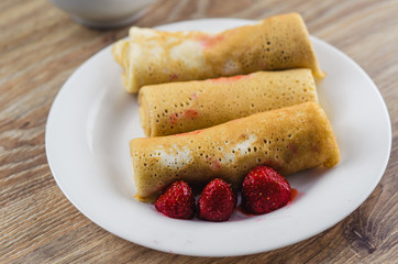 Pancakes with strawberry on a plate