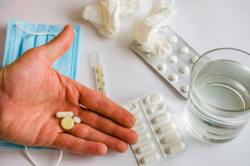 Medicine pills and thermometer