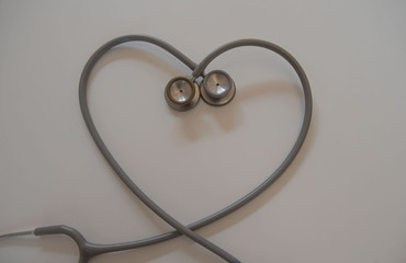closeup two stethoscope on White table . Medical concept .