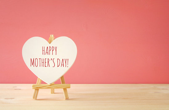 mother's day concept image. Board by heart shape