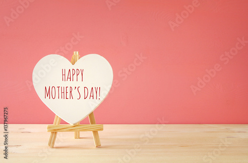 mother's day concept image. Board by heart shape