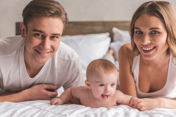 Young couple with baby © georgerudy