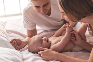 Young couple with baby © georgerudy