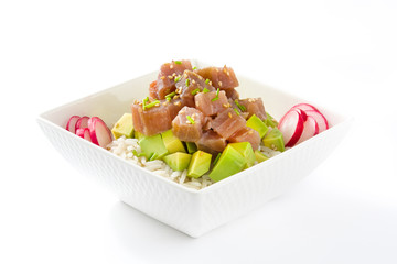 Hawaiian tuna poke bowl with avocado, radishes and sesame seeds, isolated on white background
