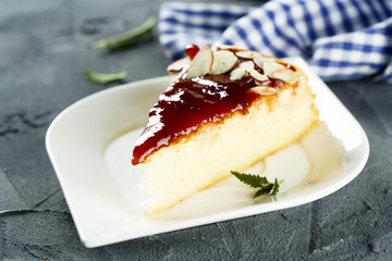Cheesecake with berry sauce and almond