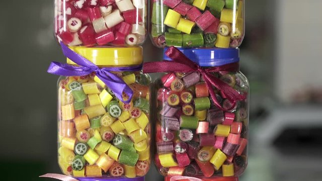 Different colorful candy in the jar of glass