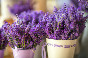 Fresh lavender in the English farm shop is in vintage white metal pails