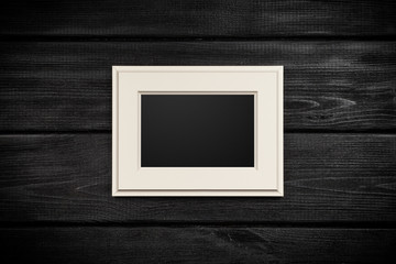 Picture frame on a wooden wall