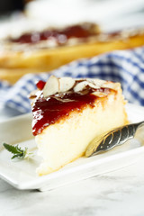 Cheesecake with berry sauce and almond