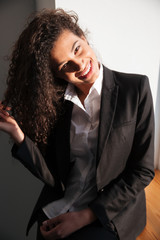 Gorgeous african businesswoman standing over white background