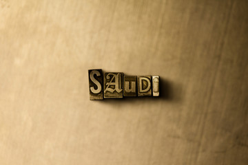 SAUDI - close-up of grungy vintage typeset word on metal backdrop. Royalty free stock illustration.  Can be used for online banner ads and direct mail.