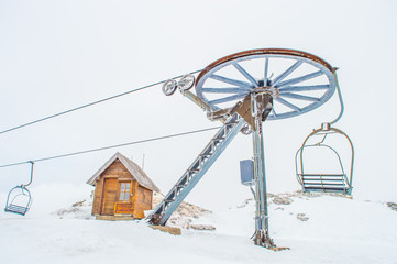 Cable car, cottage and snow
