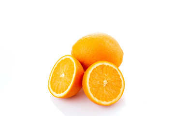 Oranges cut to half with whole orange on background