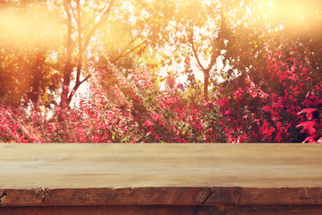 Naklejka na ściany i meble Empty table in front of spring beautiful field flowers