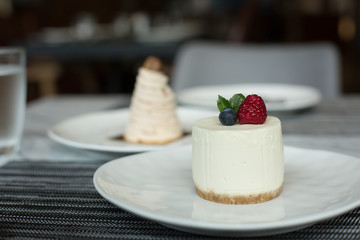 Plates of Cheesecake and Mont Blanc on Table in Restaurant