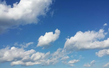 Beautiful fluffy clouds in blue sky, natural cloudscape