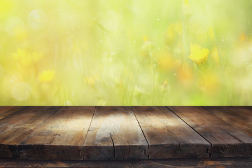Empty table in front of spring flowers background