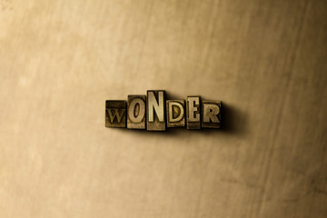 WONDER - close-up of grungy vintage typeset word on metal backdrop. Royalty free stock illustration.  Can be used for online banner ads and direct mail.